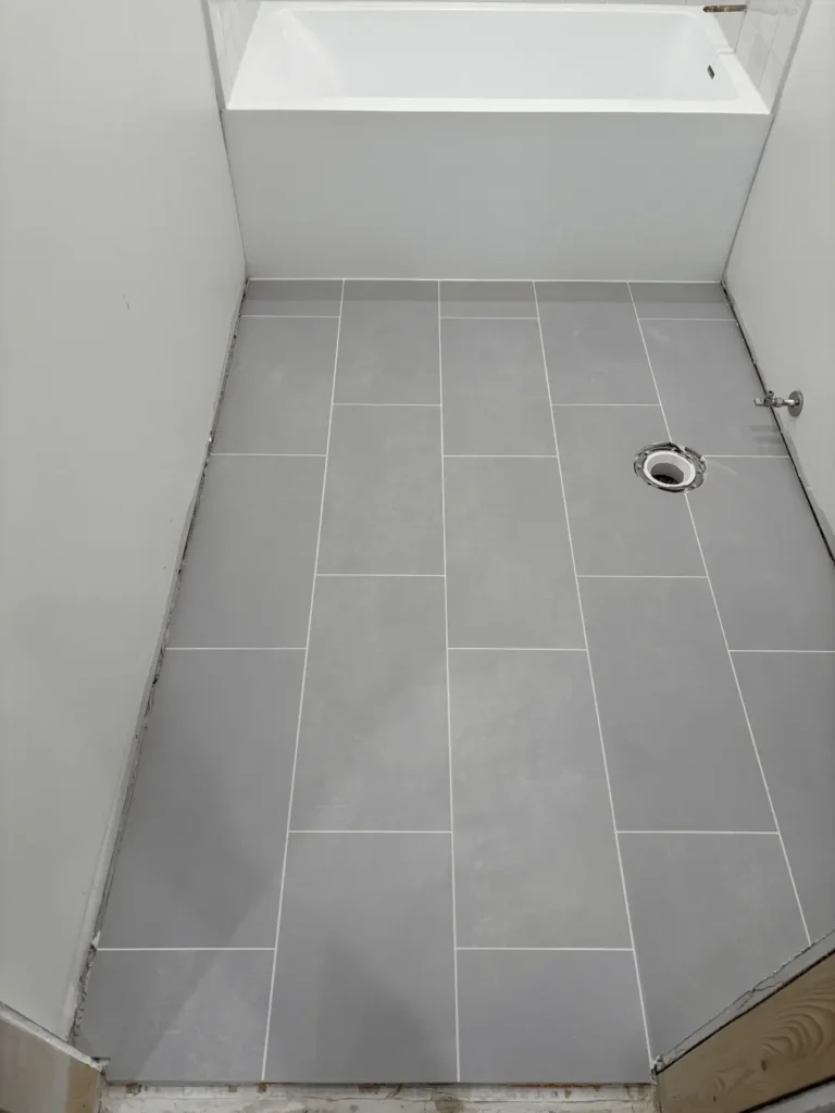 Grey tile flooring bathroom project in Duluth