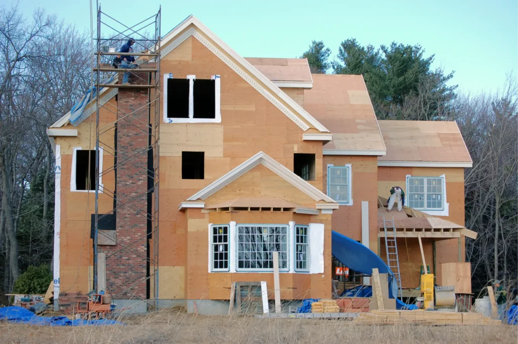 Restored brick and stone chimney blending with rustic exterior design