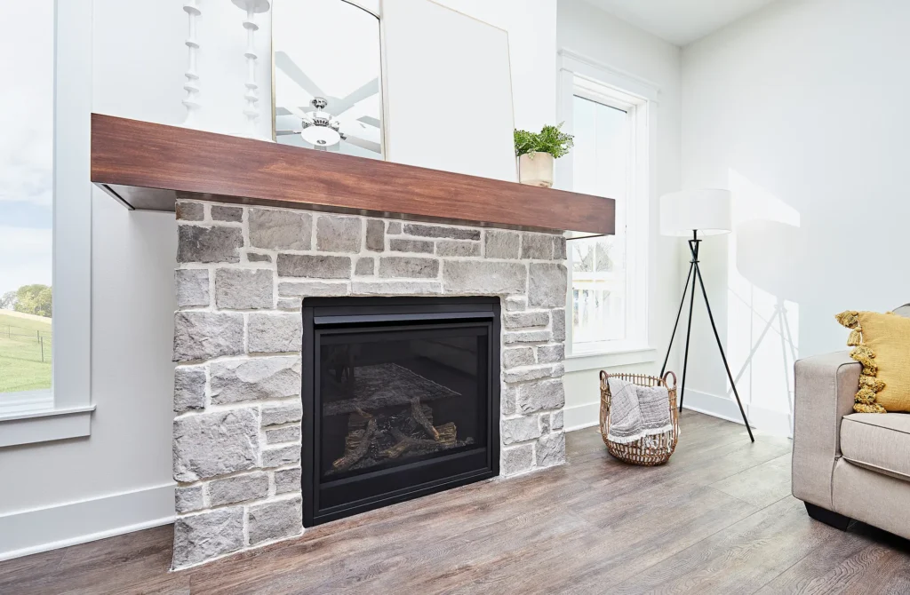 Modern fireplace surrounded by stone hearth